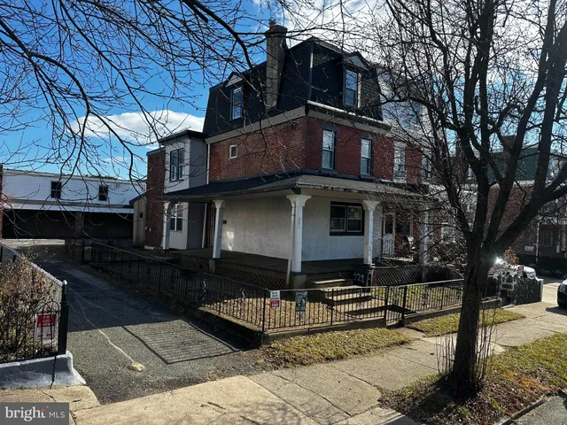a front view of a house with yard