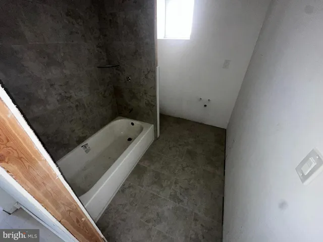 a view of a livingroom with wooden floor and a cabinet