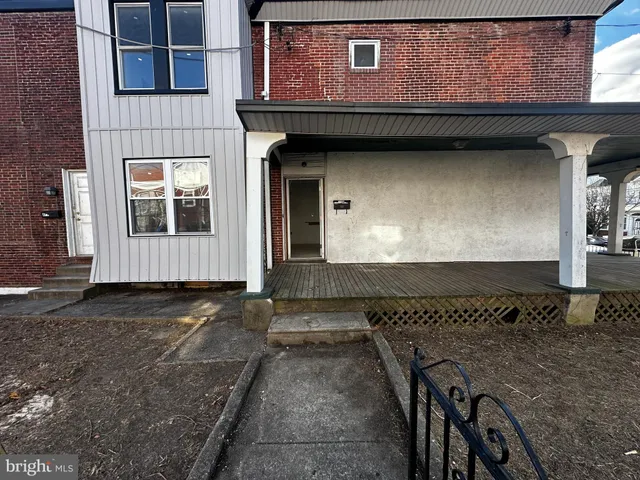a bathroom with a granite countertop sink