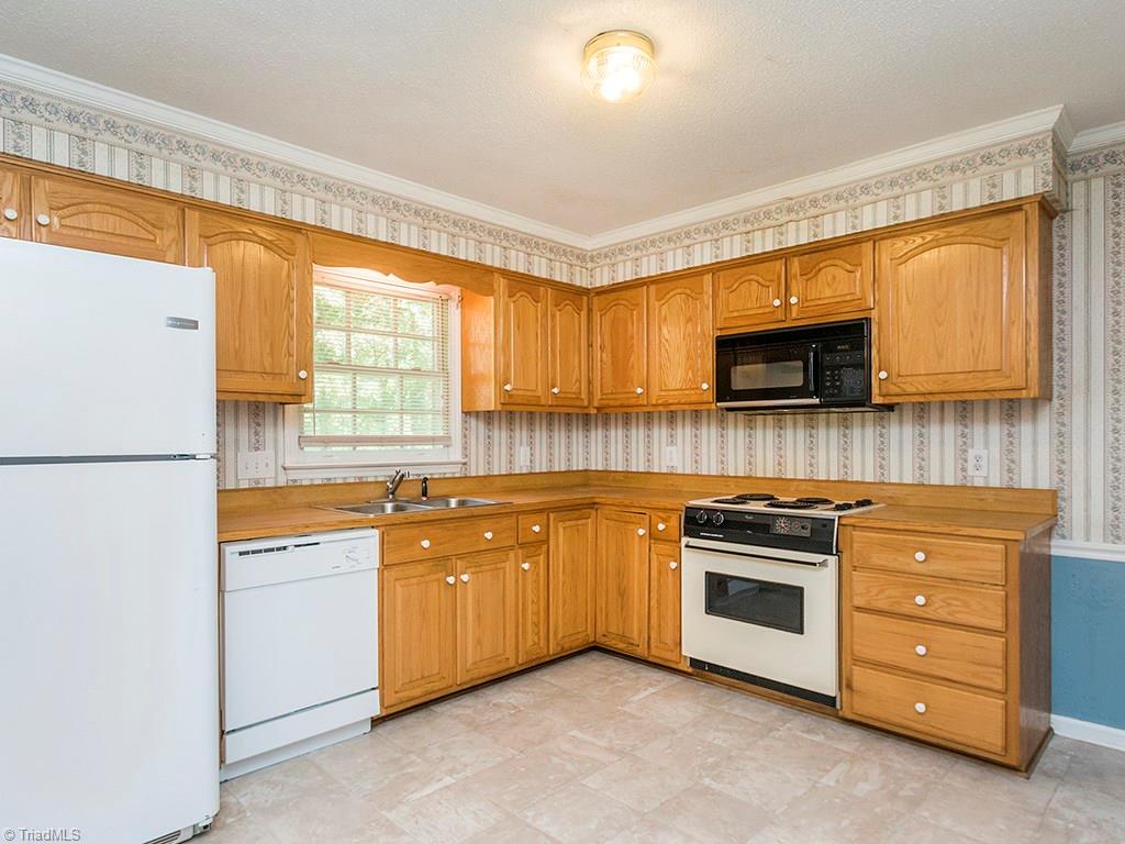 910 Trollinger Road Graham, NC 27253 - Photo 17 of 28 Kitchen, refrigerator remains