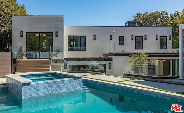 a swimming pool with outdoor seating
