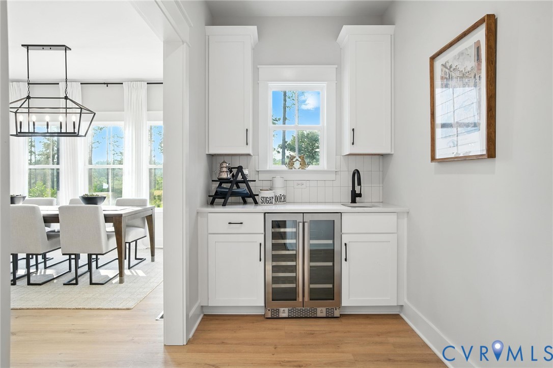 2 Winding Acres Lane New Kent, VA 23124 - Photo 15 of 31 a kitchen with a refrigerator and windows
