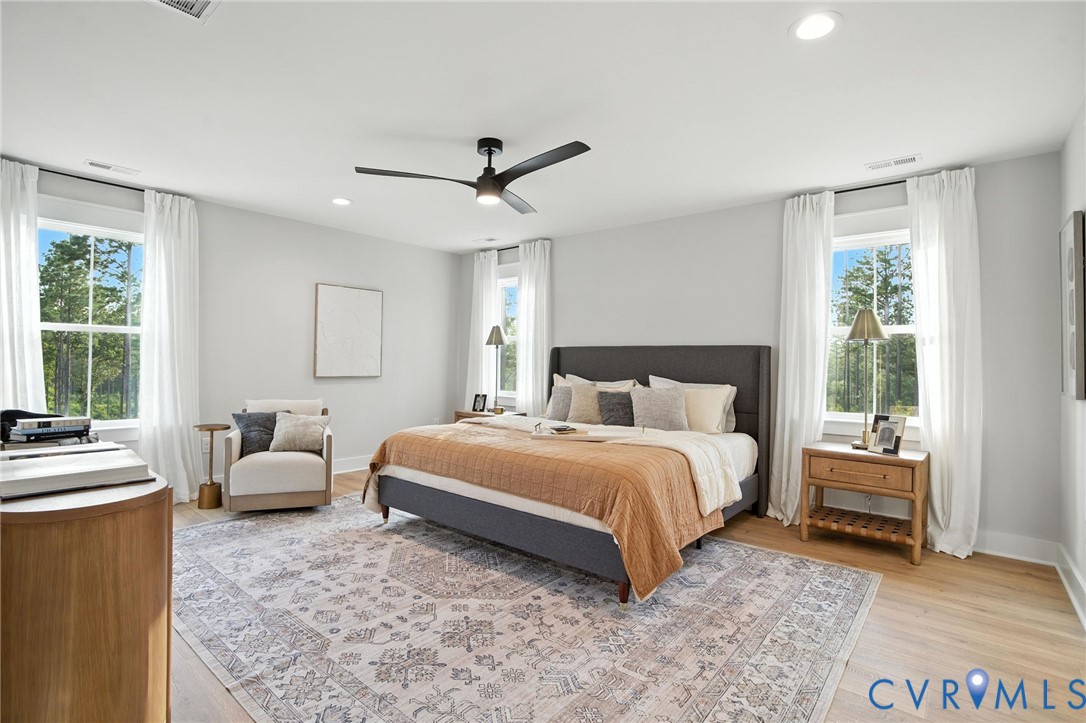 2 Winding Acres Lane New Kent, VA 23124 - Photo 19 of 31 a spacious bedroom with a bed and a couch