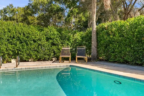 a view of a swimming pool with a patio
