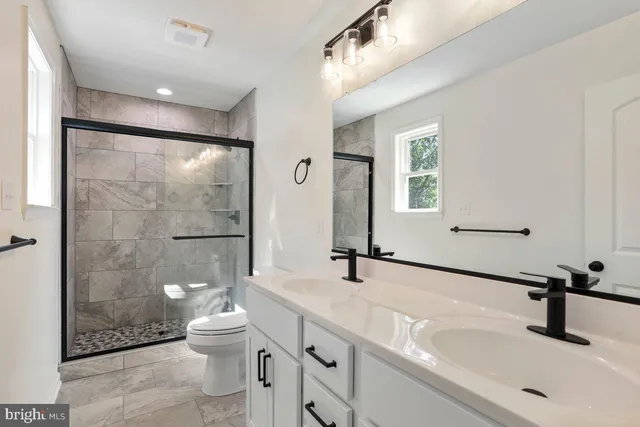 a bathroom with a sink and a large mirror