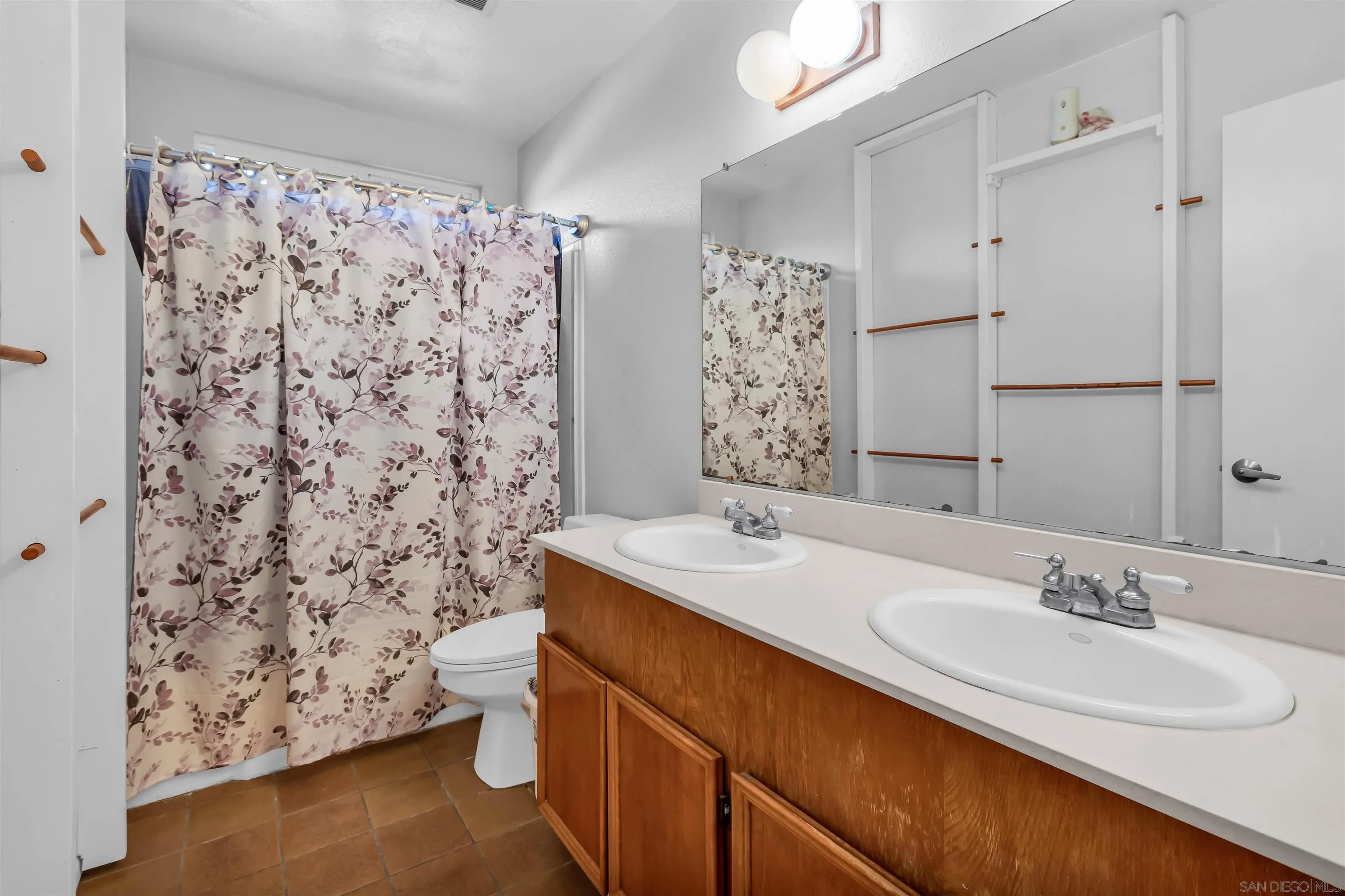 341 Paraiso Avenue Spring Valley, CA 91977 - Photo 21 of 35 a bathroom with a sink toilet and shower