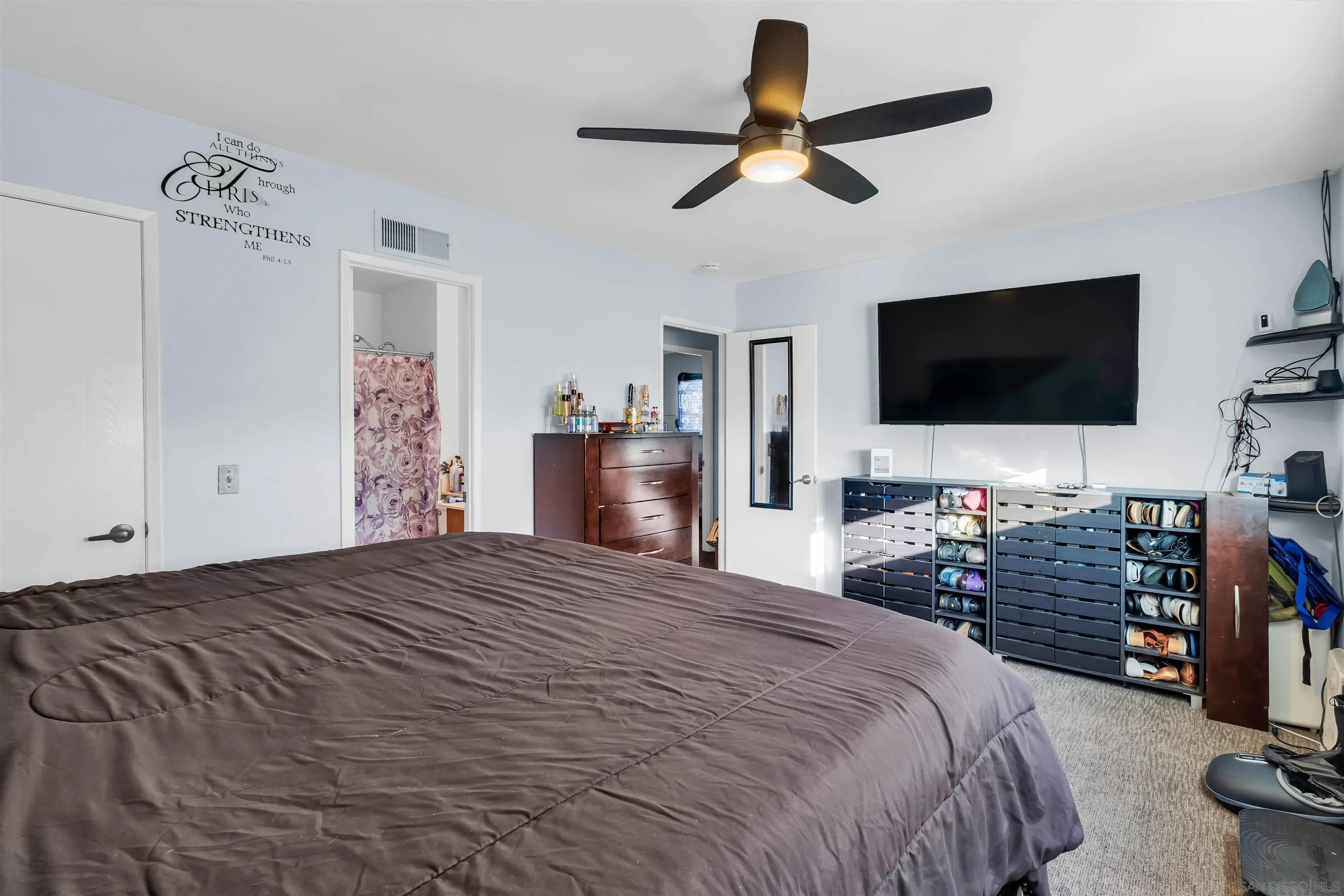 341 Paraiso Avenue Spring Valley, CA 91977 - Photo 22 of 35 a bedroom with a bed and a flat screen tv