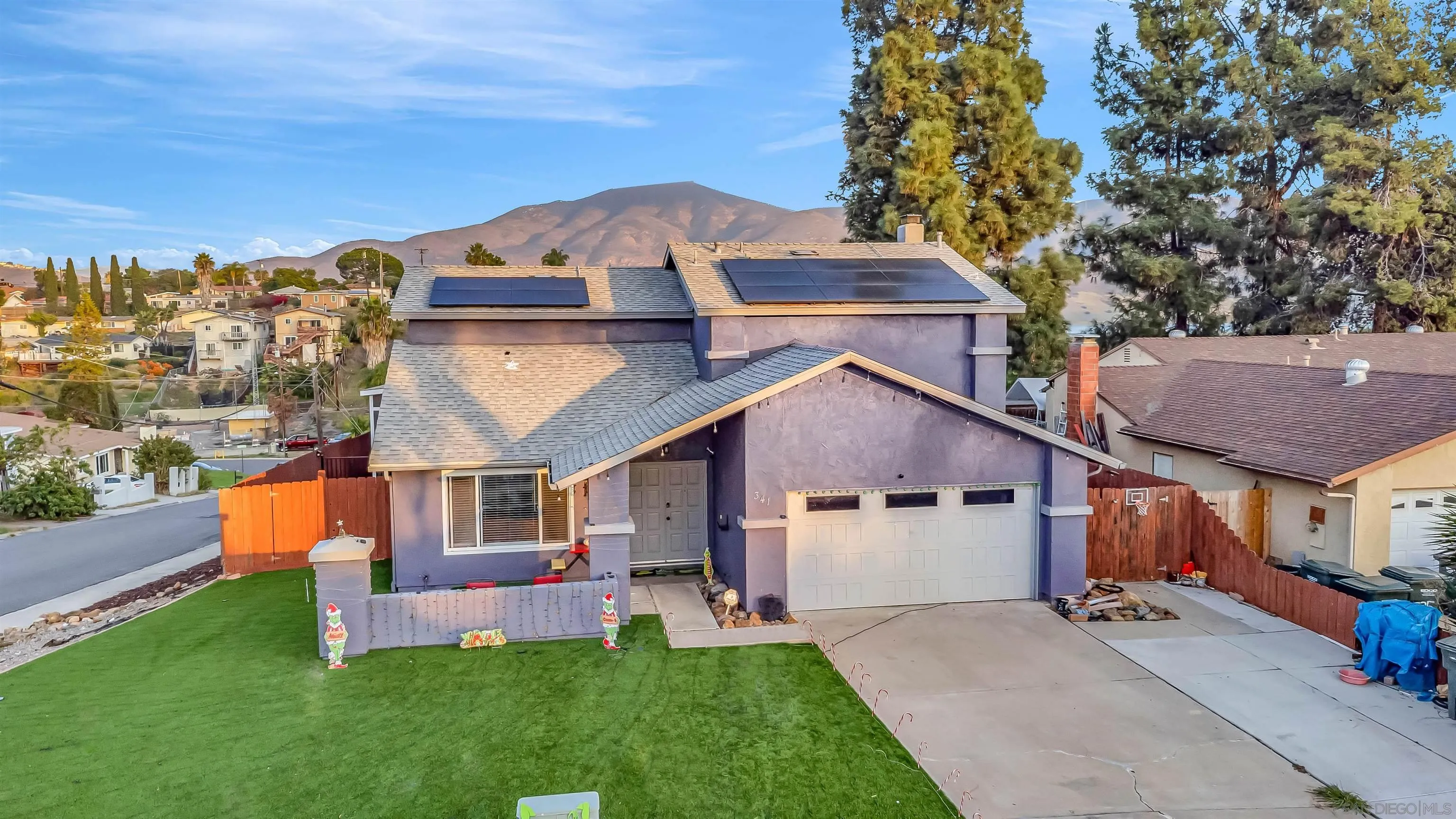 341 Paraiso Avenue Spring Valley, CA 91977 - Photo 32 of 35 a front view of a house with a garden and trees
