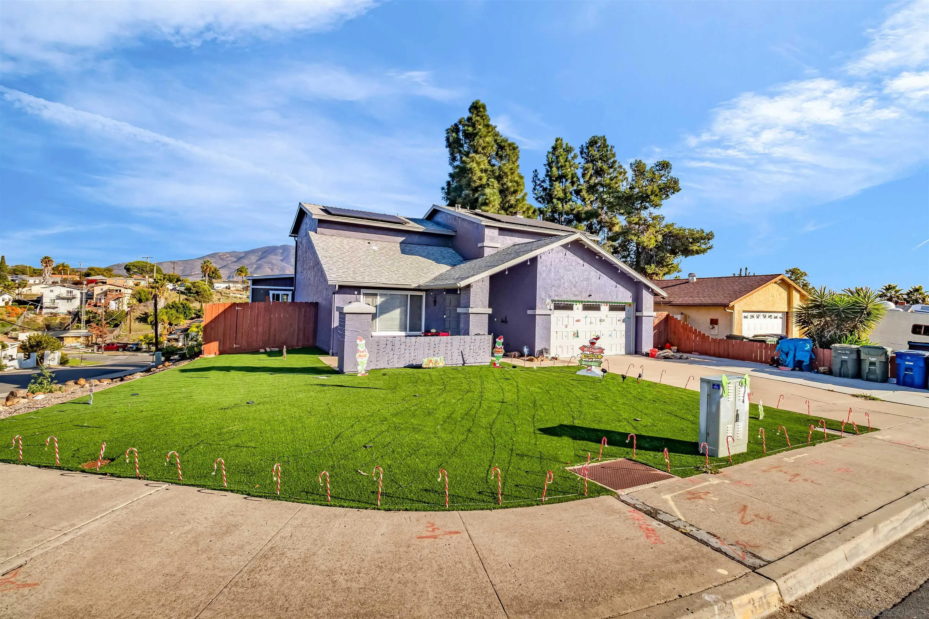341 Paraiso Avenue Spring Valley, CA 91977 - Photo 33 of 35 a view of a house with a yard and potted plants