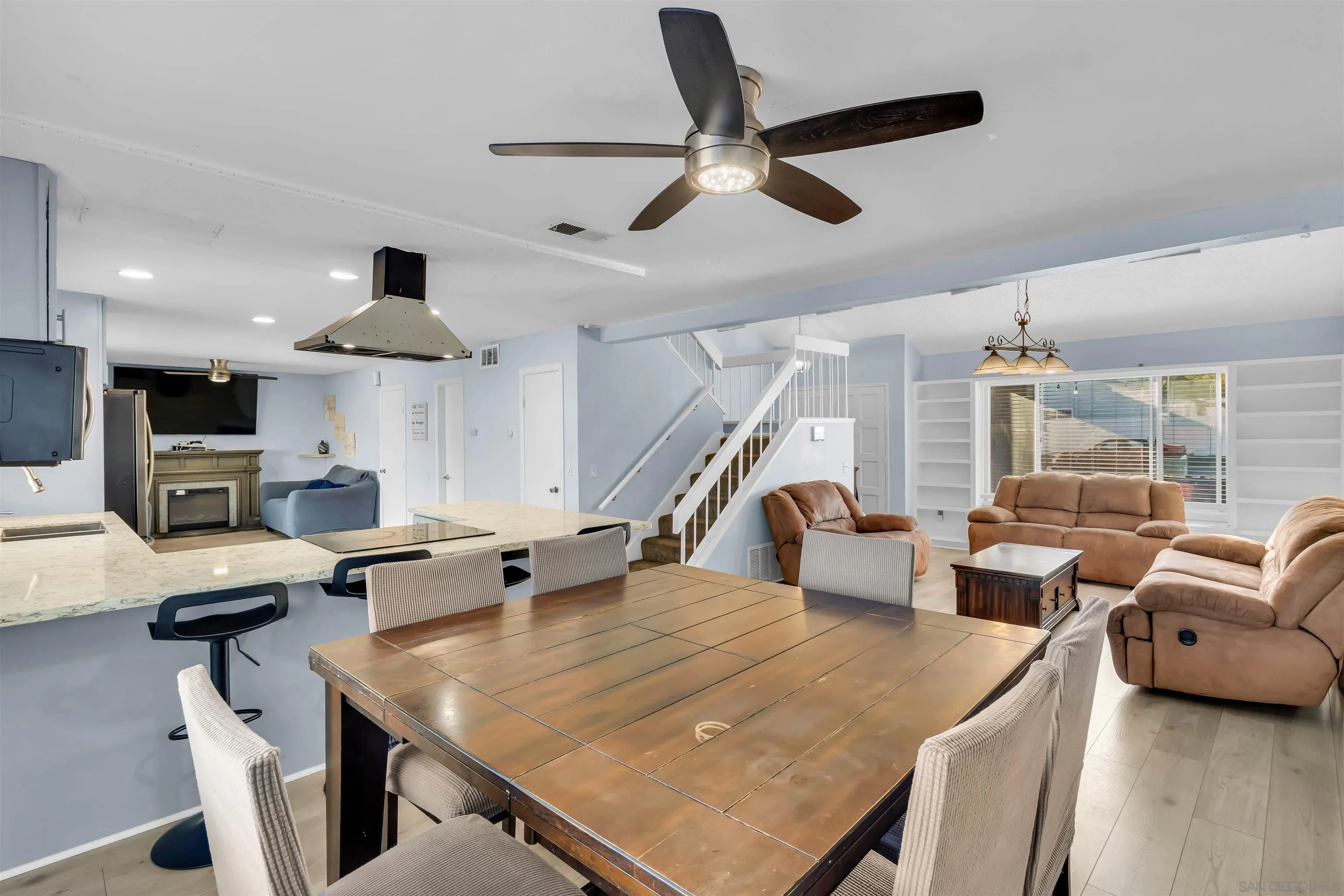 341 Paraiso Avenue Spring Valley, CA 91977 - Photo 6 of 35 a living room with lots of furniture and a chandelier