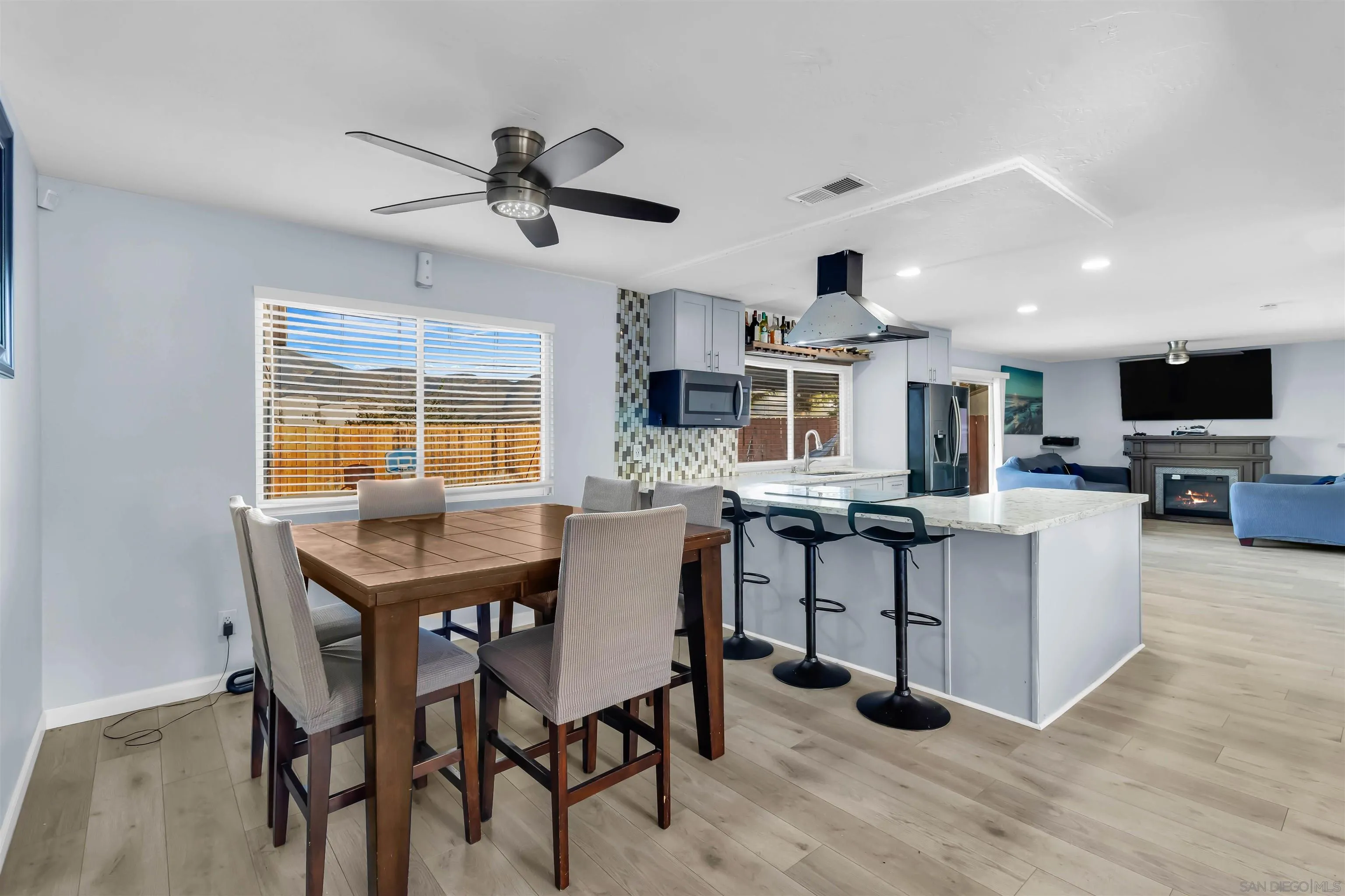 341 Paraiso Avenue Spring Valley, CA 91977 - Photo 8 of 35 a view of a dining room with furniture and a window