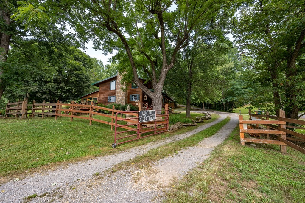 7818 Berry Williams Road Townsend, TN 37882 - Photo 20 of 34 a view of a house with a yard porch and sitting area