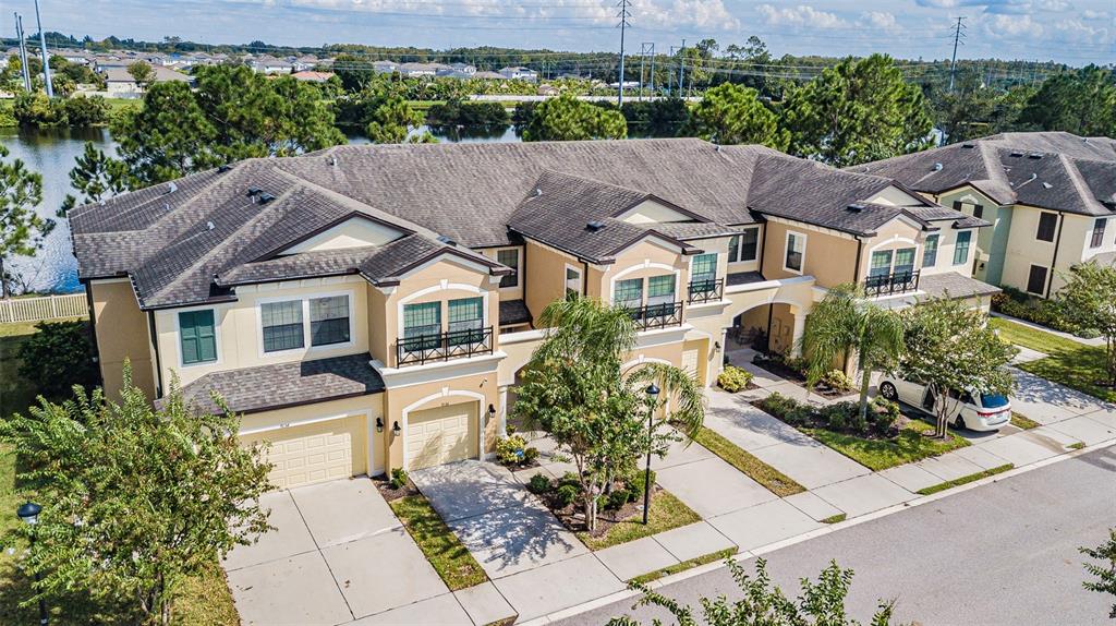 9136 Fox Sparrow Road Tampa, FL 33626 - Photo 1 of 1 an aerial view of a house with a garden