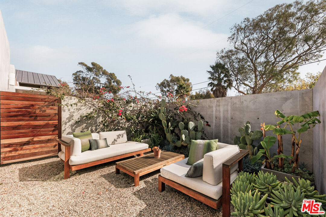6728 Wildlife Road Malibu, CA 90265 - Photo 28 of 57 a outdoor living space with furniture and a potted plant