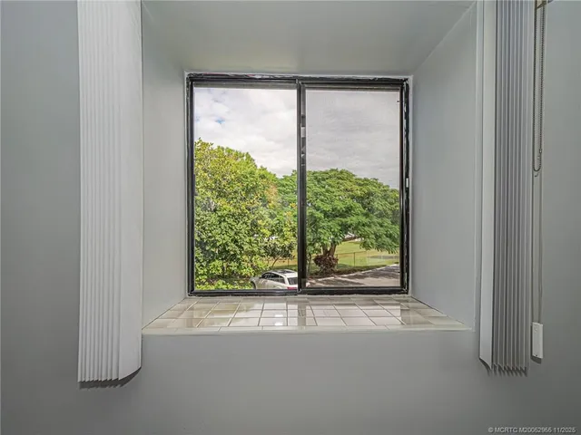 a view of a room that has a window in it