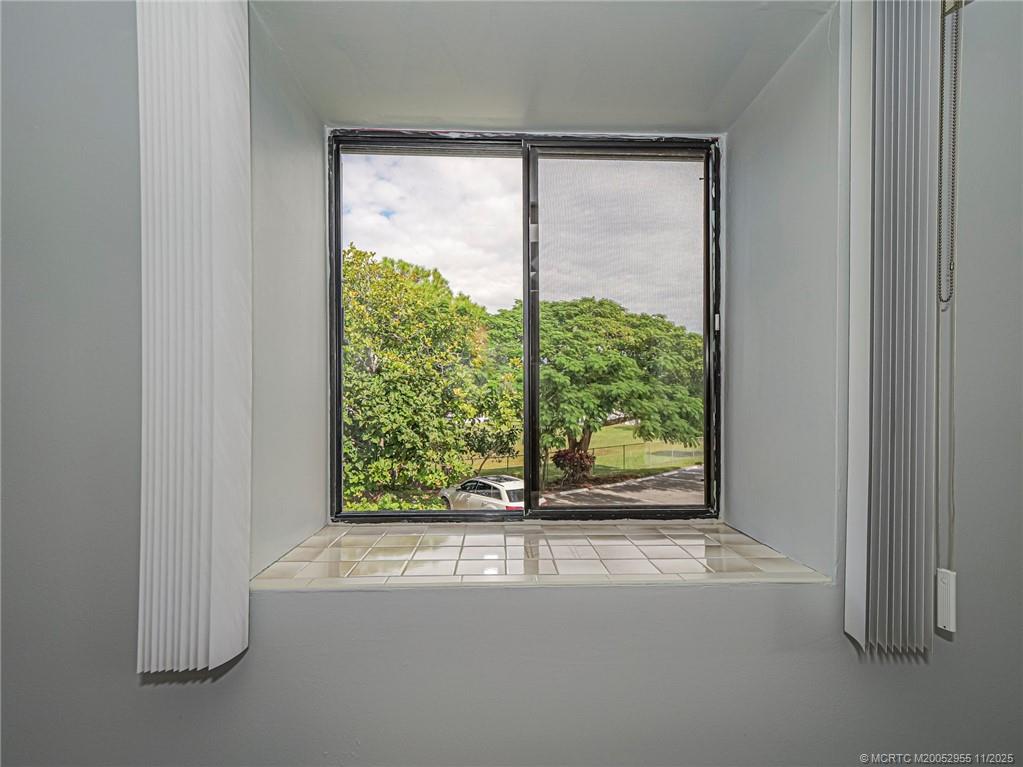 3001 Southeast Aster Lane, Unit 908 Stuart, FL 34994 - Photo 17 of 35 a view of a room that has a window in it