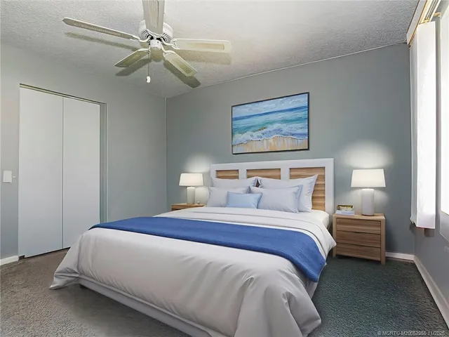 a bedroom with bed and window