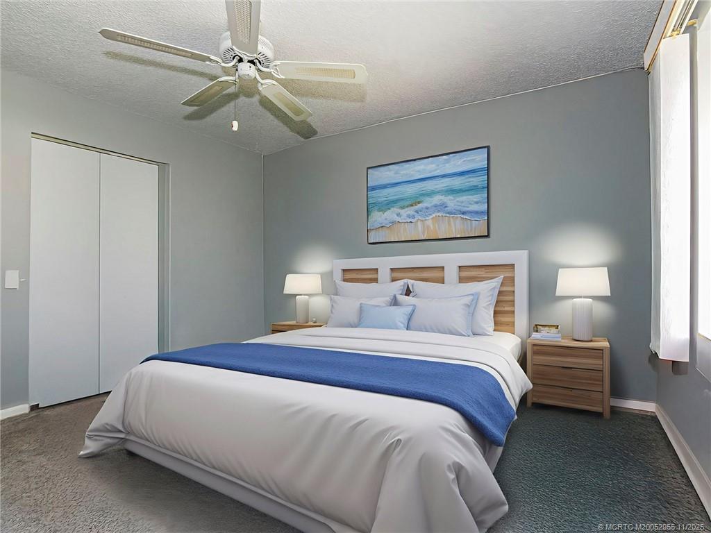 3001 Southeast Aster Lane, Unit 908 Stuart, FL 34994 - Photo 19 of 35 a bedroom with bed and window