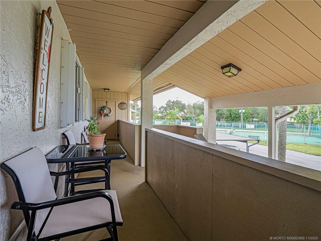 3001 Southeast Aster Lane, Unit 908 Stuart, FL 34994 - Photo 2 of 35 a dining room with furniture and a large window