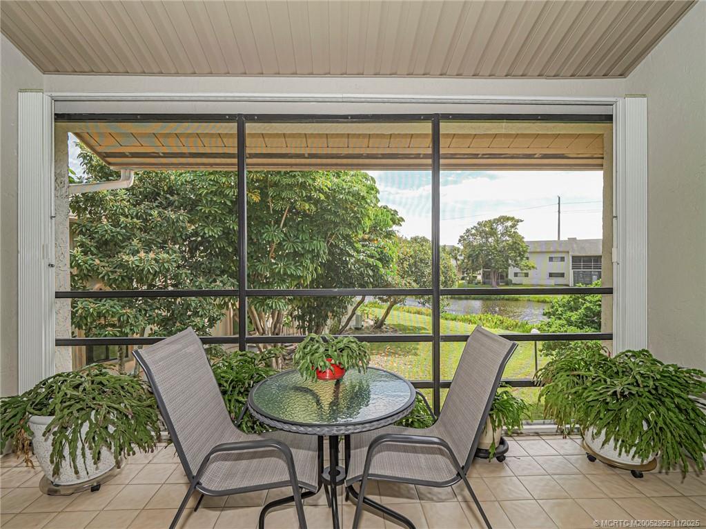 3001 Southeast Aster Lane, Unit 908 Stuart, FL 34994 - Photo 21 of 35 a view of a dining room with furniture window and outside view