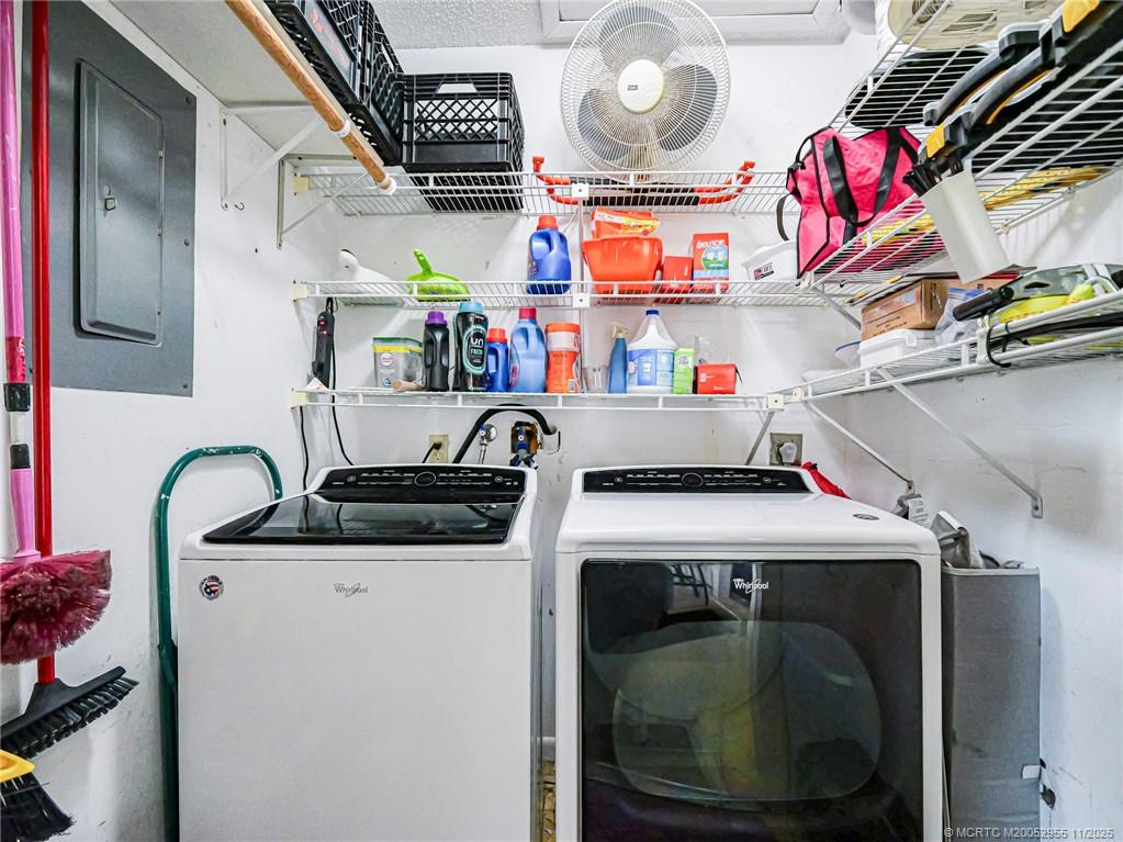 3001 Southeast Aster Lane, Unit 908 Stuart, FL 34994 - Photo 23 of 35 a utility room with dryer and washer