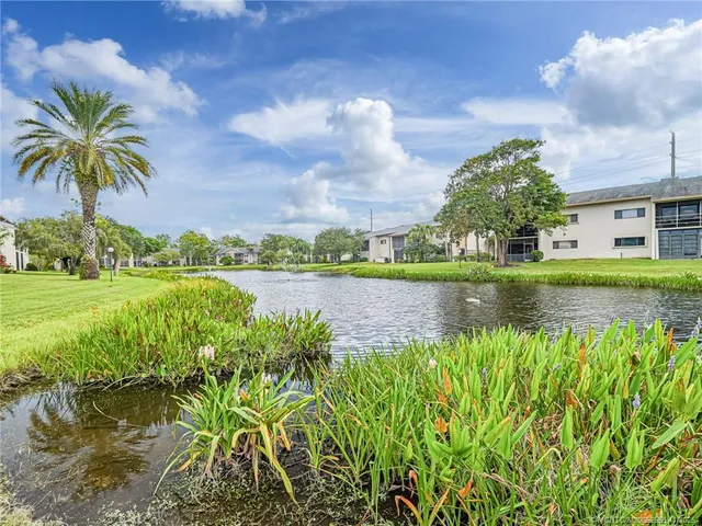 a view of a lake with a building in the background