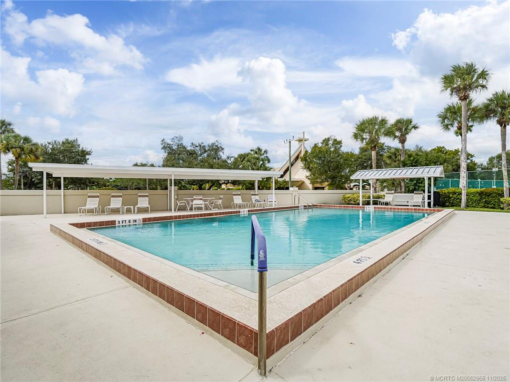 3001 Southeast Aster Lane, Unit 908 Stuart, FL 34994 - Photo 34 of 35 a view of a swimming pool with a terrace