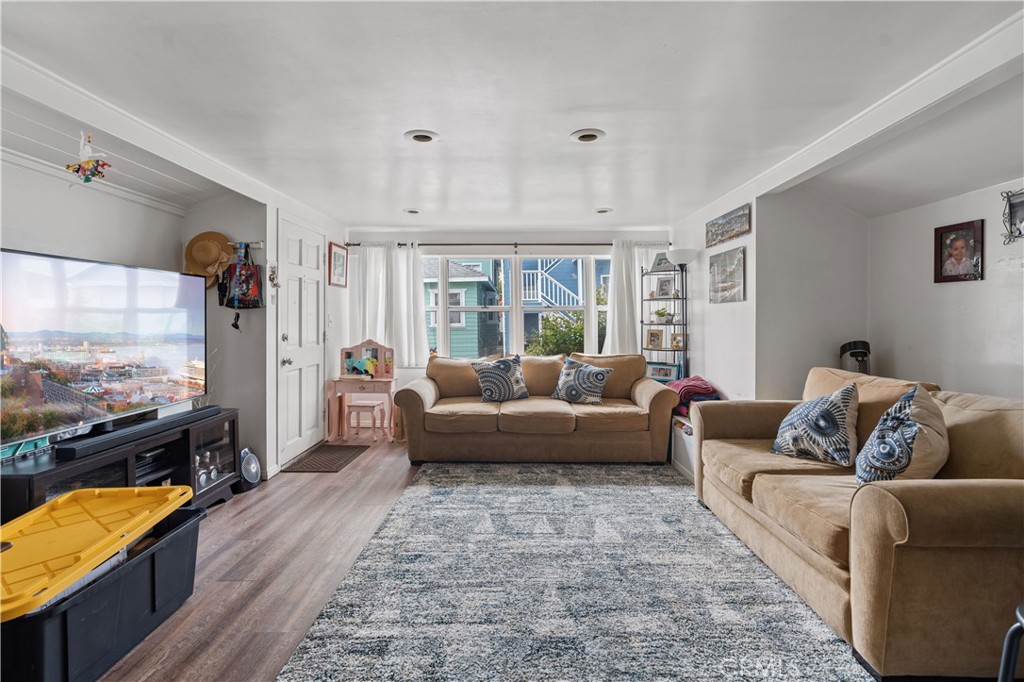 343 Eucalyptus Avenue Avalon, CA 90704 - Photo 6 of 35 a living room with furniture and a flat screen tv