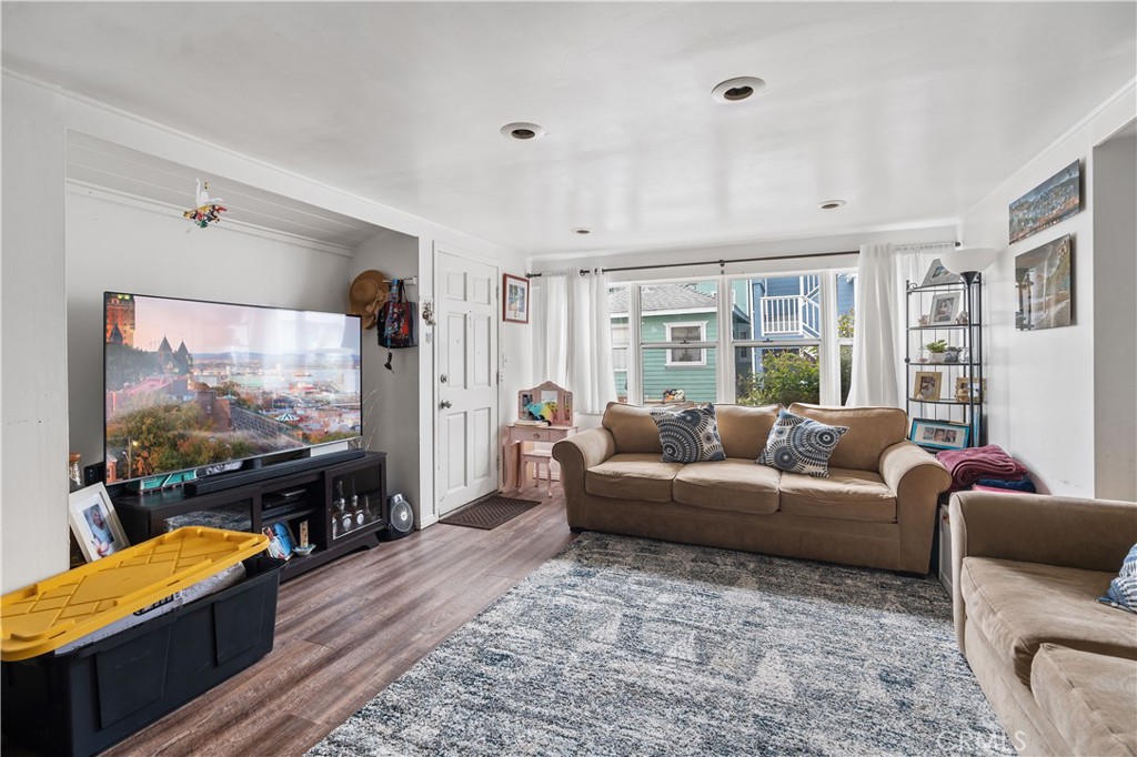 343 Eucalyptus Avenue Avalon, CA 90704 - Photo 7 of 35 a living room with furniture and a flat screen tv