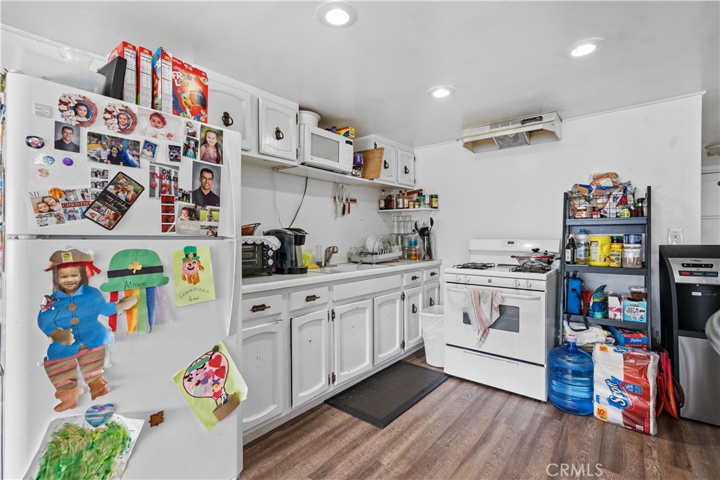 343 Eucalyptus Avenue Avalon, CA 90704 - Photo 10 of 35 a kitchen with refrigerator and cabinets