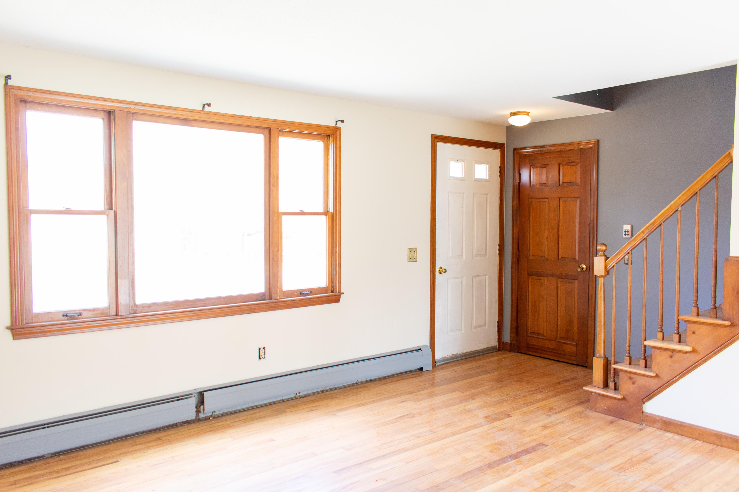 398 Lincoln Rd Extension Hyannis, MA 02601 - Photo 5 of 26 a view of an empty room with wooden floor and a window