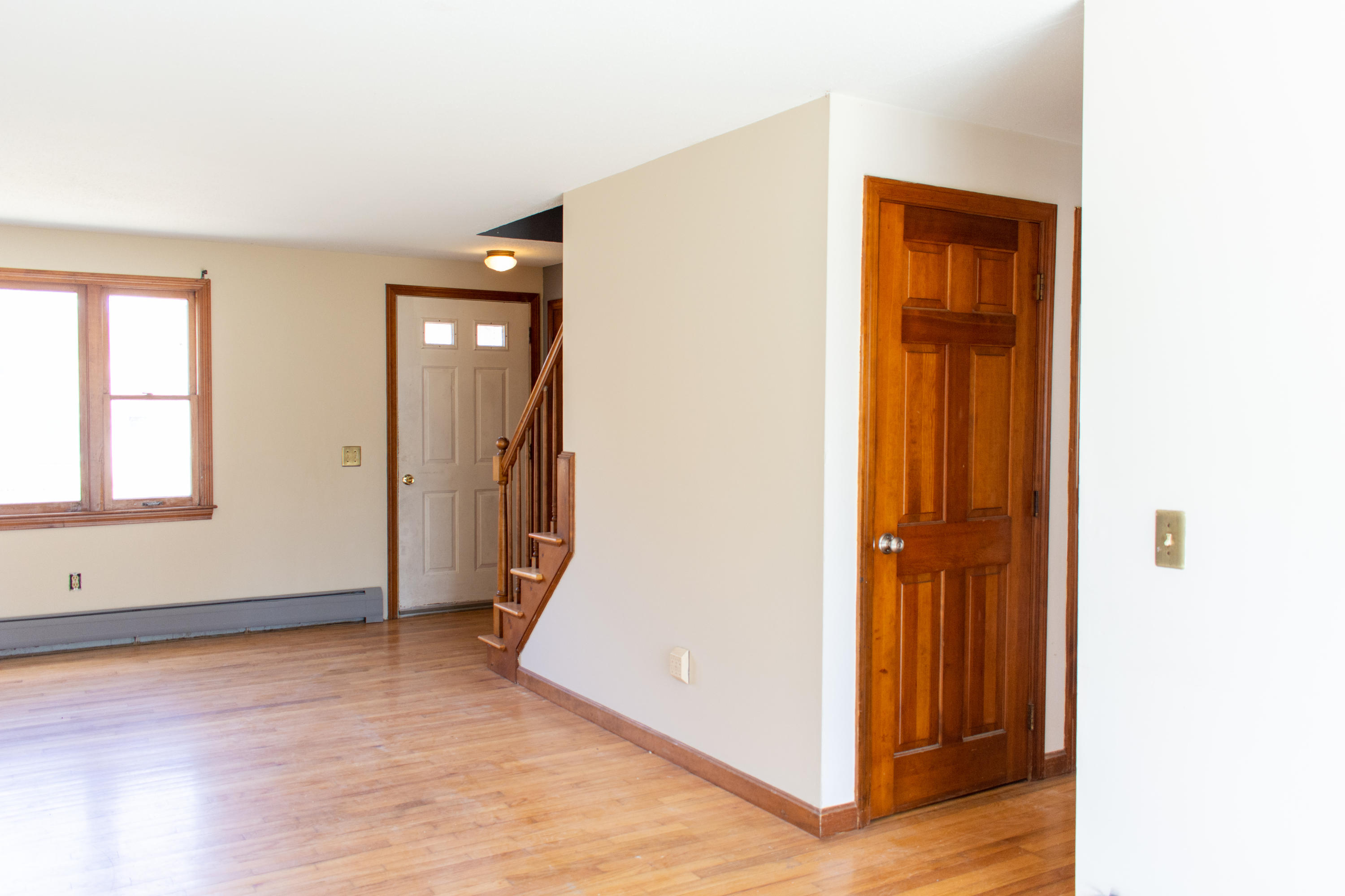 398 Lincoln Rd Extension Hyannis, MA 02601 - Photo 6 of 26 wooden floor in an empty room with a window