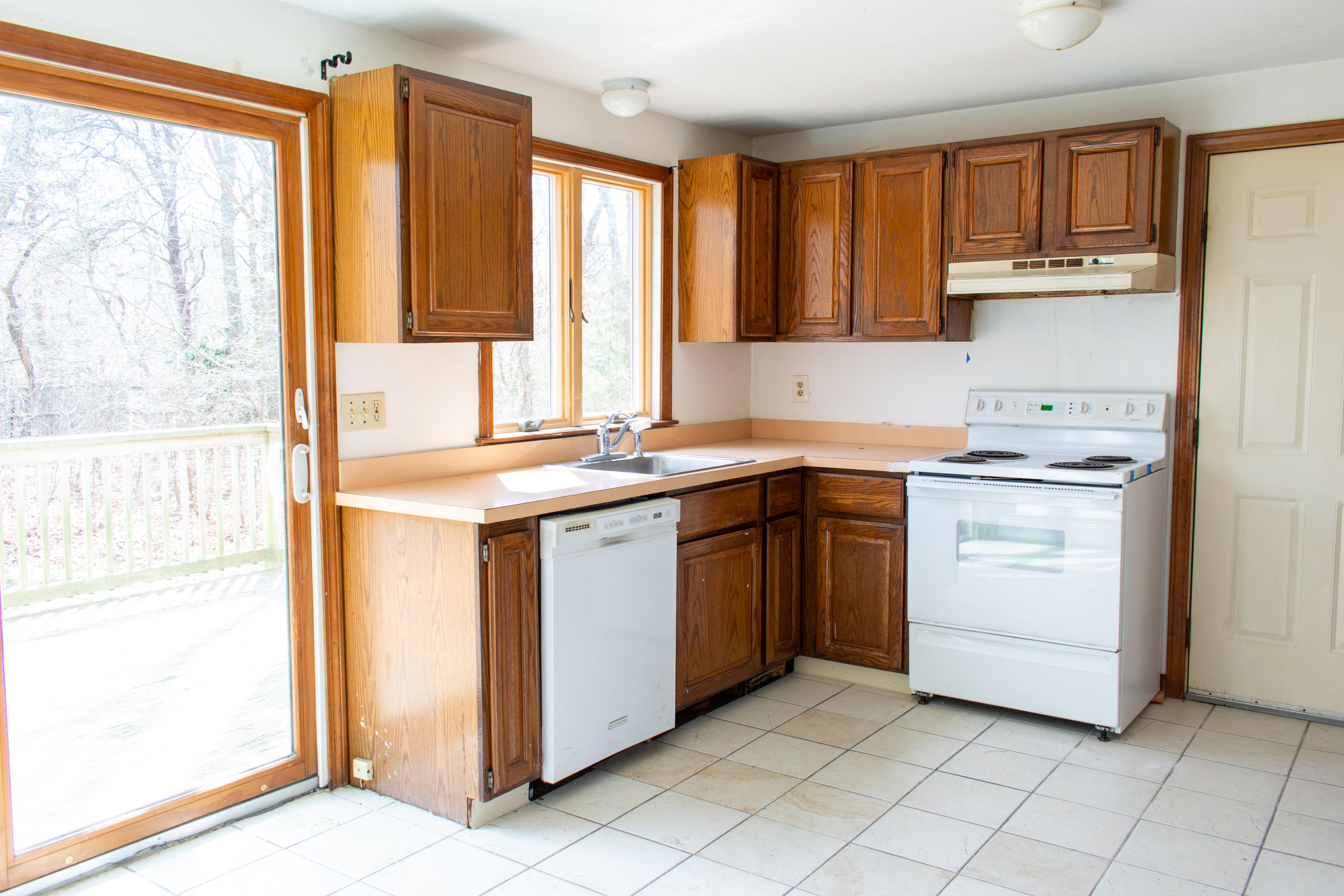 398 Lincoln Rd Extension Hyannis, MA 02601 - Photo 7 of 26 a kitchen with a stove sink and cabinets