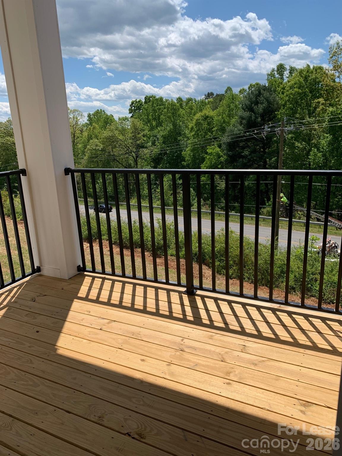 50 Riverside Drive Hickory, NC 28601 - Photo 4 of 16 a view of balcony with wooden floor and fence