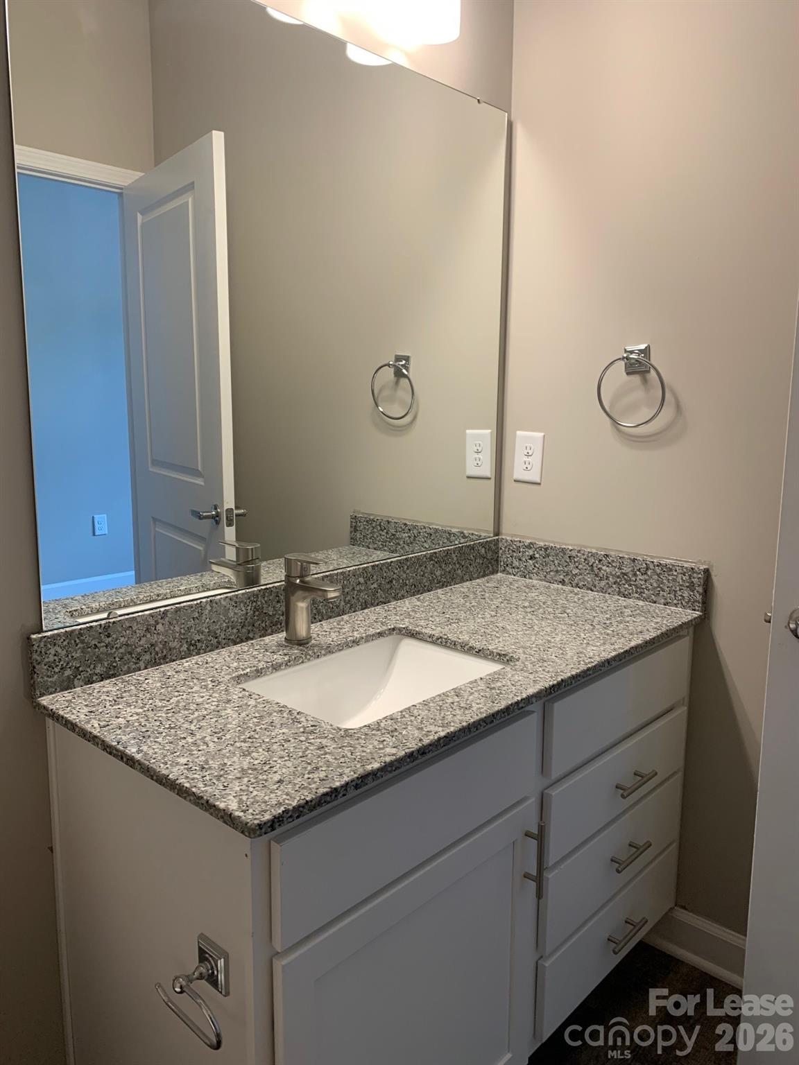 50 Riverside Drive Hickory, NC 28601 - Photo 9 of 16 a bathroom with a granite countertop sink and a mirror