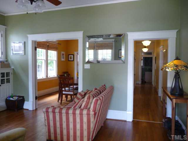 414 Cutler Street Raleigh, NC 27603 - Photo 12 of 12 The versatile floor plan includes a long central hall, 4 bedrooms plus a study/office/guest room. Handsome light fixtures and ceiling fans have been added throughout the house. Interior Space/Layout