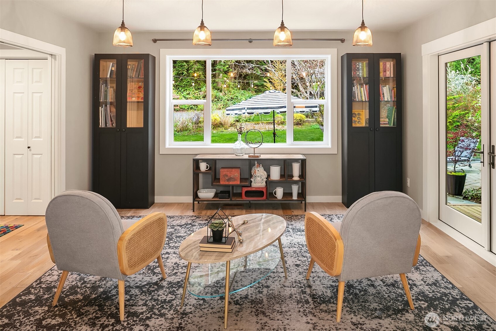 16524 Mink Road Northeast Woodinville, WA 98077 - Photo 11 of 40 a dining room with furniture a chandelier and wooden floor