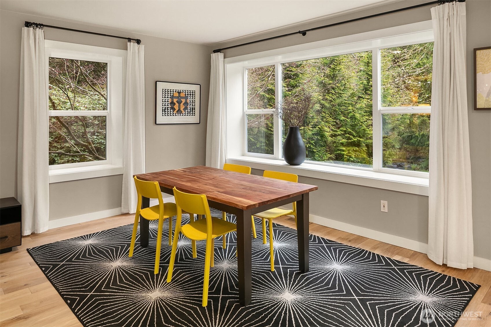 16524 Mink Road Northeast Woodinville, WA 98077 - Photo 14 of 40 a view of a dining room with furniture a rug and wooden floor