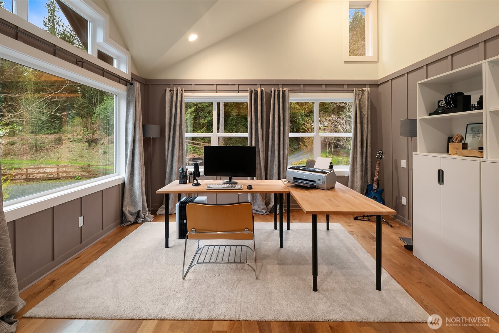 16524 Mink Road Northeast Woodinville, WA 98077 - Photo 24 of 40 a work room with furniture a rug and a window