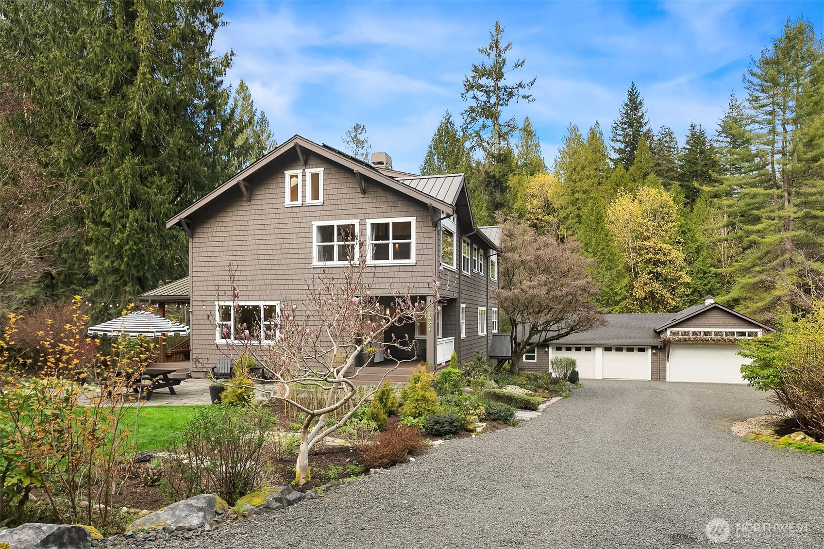 16524 Mink Road Northeast Woodinville, WA 98077 - Photo 3 of 40 a view of a house with a yard and potted plants