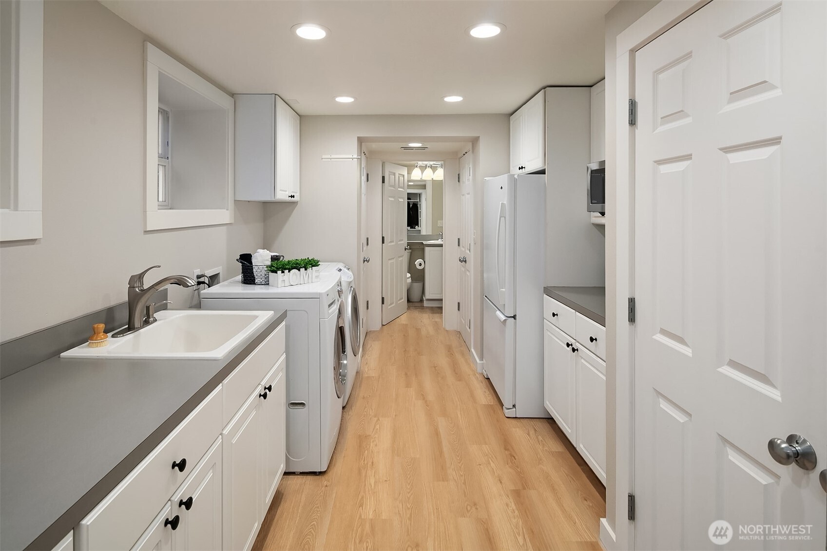 16524 Mink Road Northeast Woodinville, WA 98077 - Photo 31 of 40 a spacious bathroom with a double vanity sink and mirror