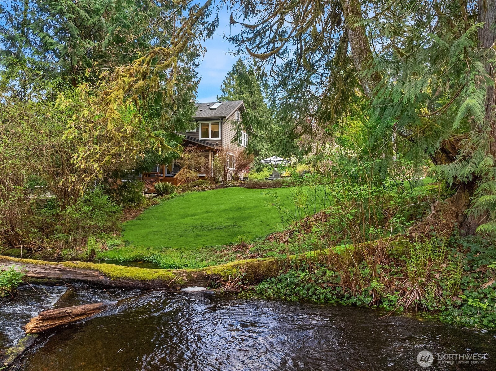 16524 Mink Road Northeast Woodinville, WA 98077 - Photo 39 of 40 a view of a backyard with plants and a garden