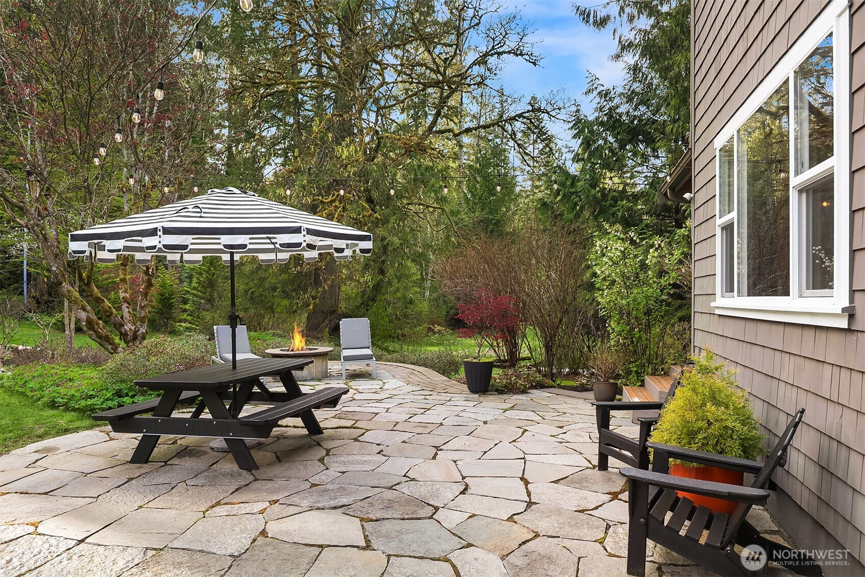 16524 Mink Road Northeast Woodinville, WA 98077 - Photo 4 of 40 a view of backyard with sitting area