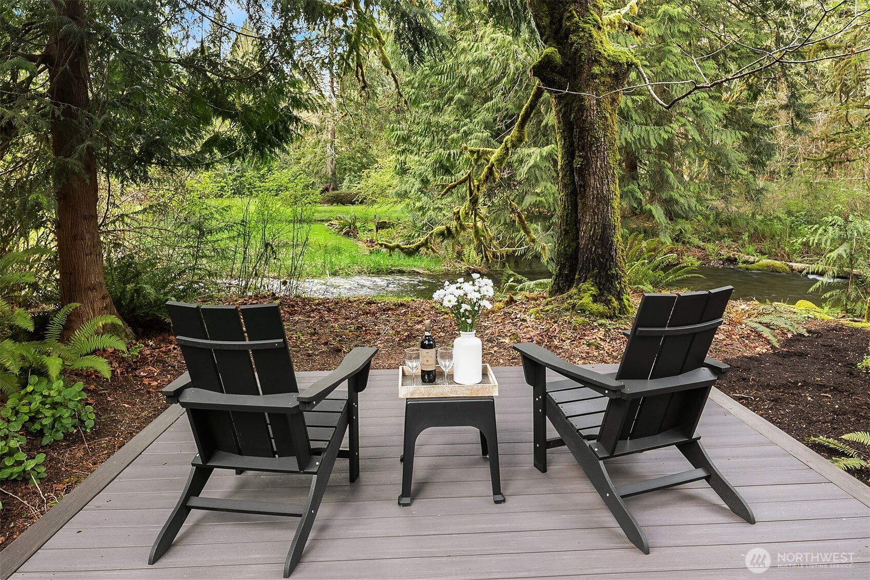 16524 Mink Road Northeast Woodinville, WA 98077 - Photo 7 of 40 a view of a chairs and table on the deck