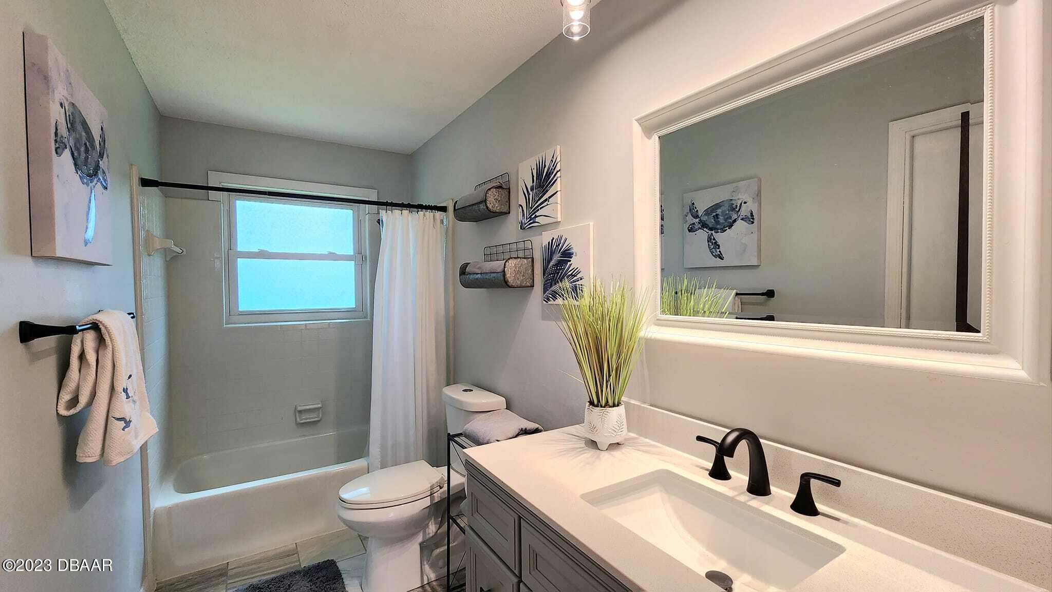 1519 North Beach Street Ormond Beach, FL 32174 - Photo 40 of 92 3rd bedroom ensuite and guest bathroom