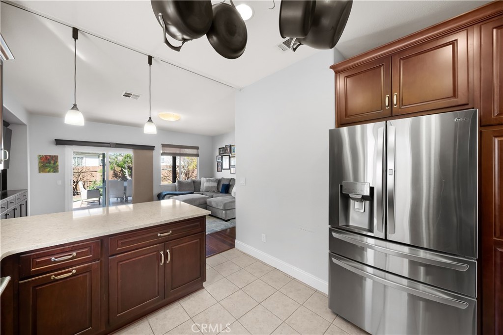 731 Voyager Road Lompoc, CA 93436 - Photo 16 of 57 a kitchen with stainless steel appliances granite countertop a refrigerator and a sink
