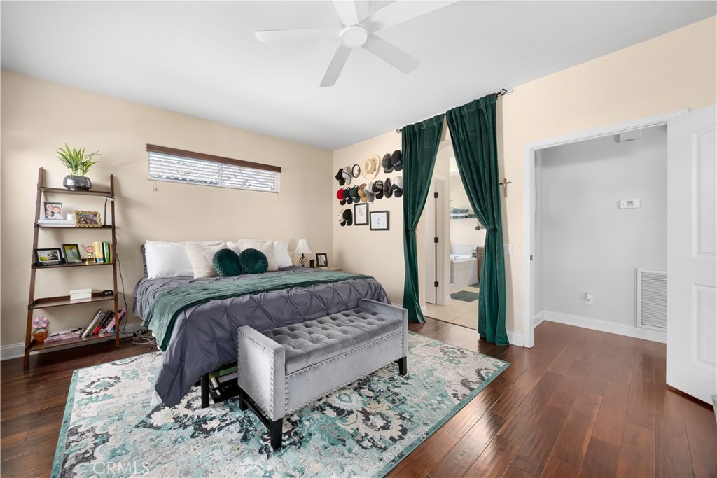 731 Voyager Road Lompoc, CA 93436 - Photo 23 of 57 a bedroom with a large bed and a wooden floor