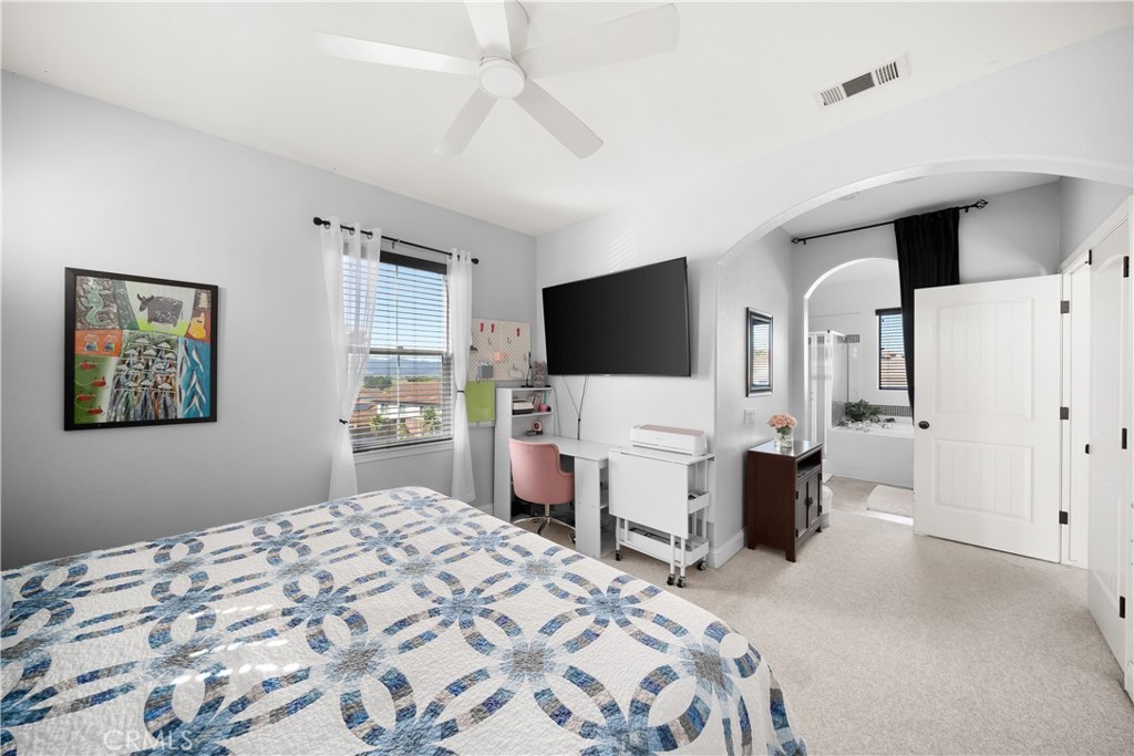 731 Voyager Road Lompoc, CA 93436 - Photo 26 of 57 a bedroom with a bed and a flat screen tv