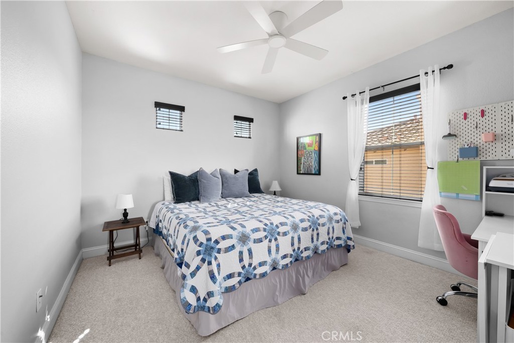 731 Voyager Road Lompoc, CA 93436 - Photo 27 of 57 a bedroom with a bed chair and a window