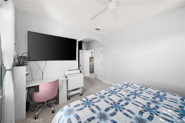 a bedroom with bed and window